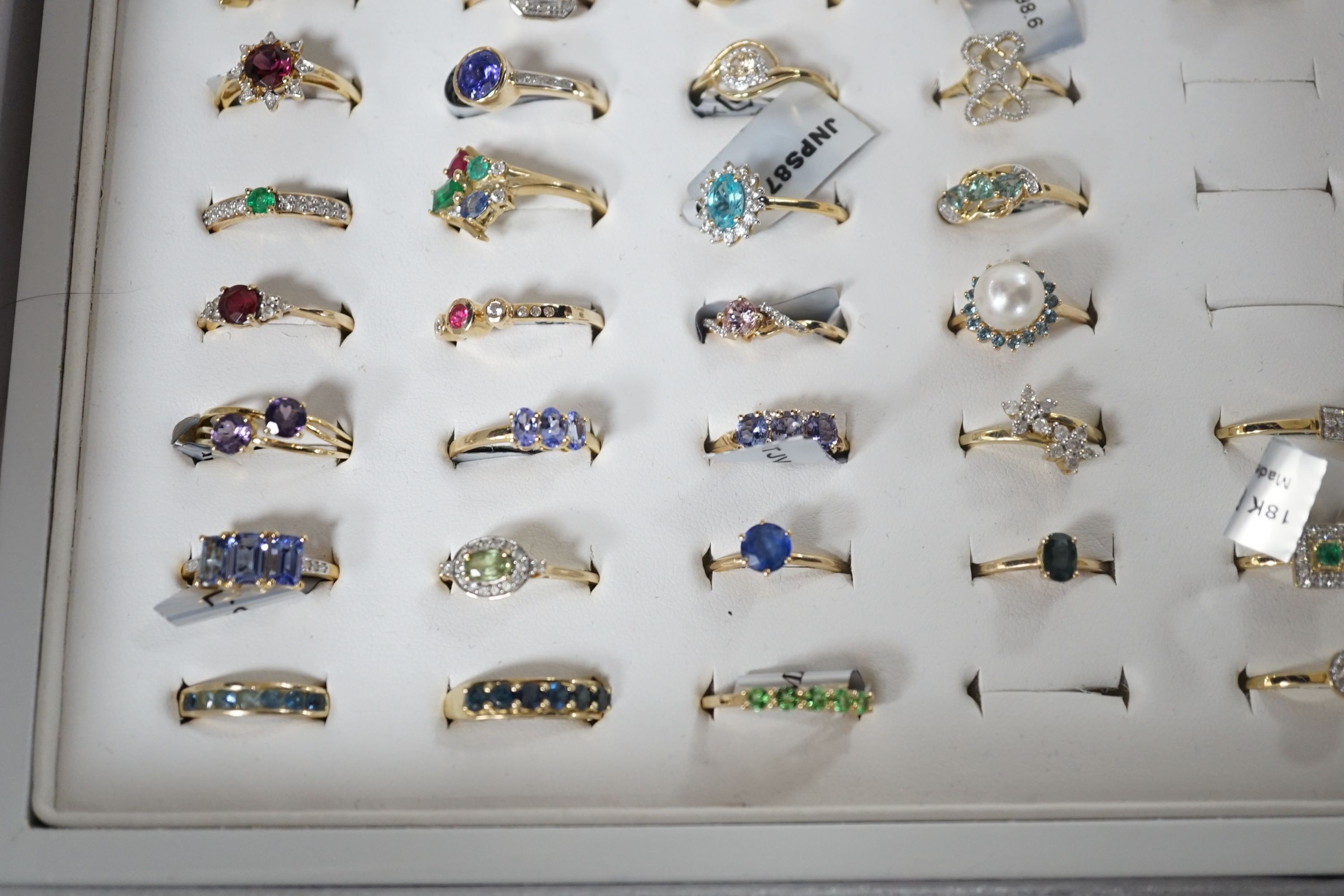 A collection of thirty nine assorted modern 9ct gold and gem set rings including amethyst, cultured pearl and emerald, three 18ct gold and gem set rings including two diamond clusters and an emerald and diamond cluster a